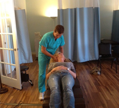 Rosemarie massaging a patient's scalp