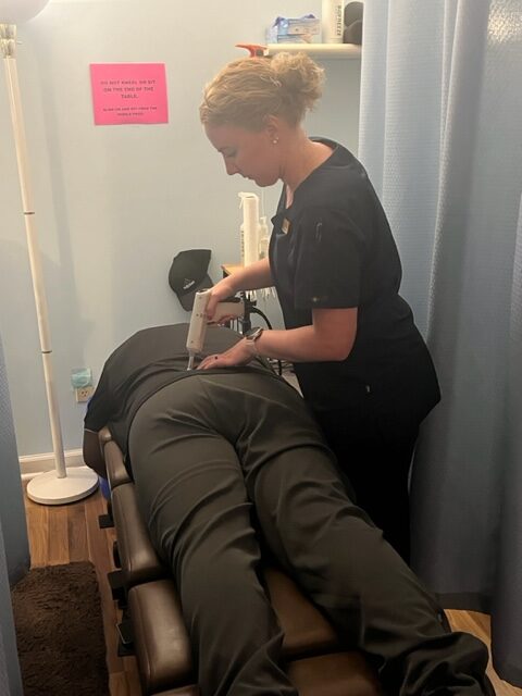 Rosemarie massaging the neck area of a patient